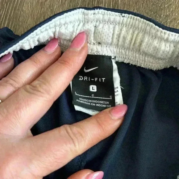 Nike shorts.  Boys size large. Listing is for both pairs.  Both are navy blue. - Picture 6 of 7